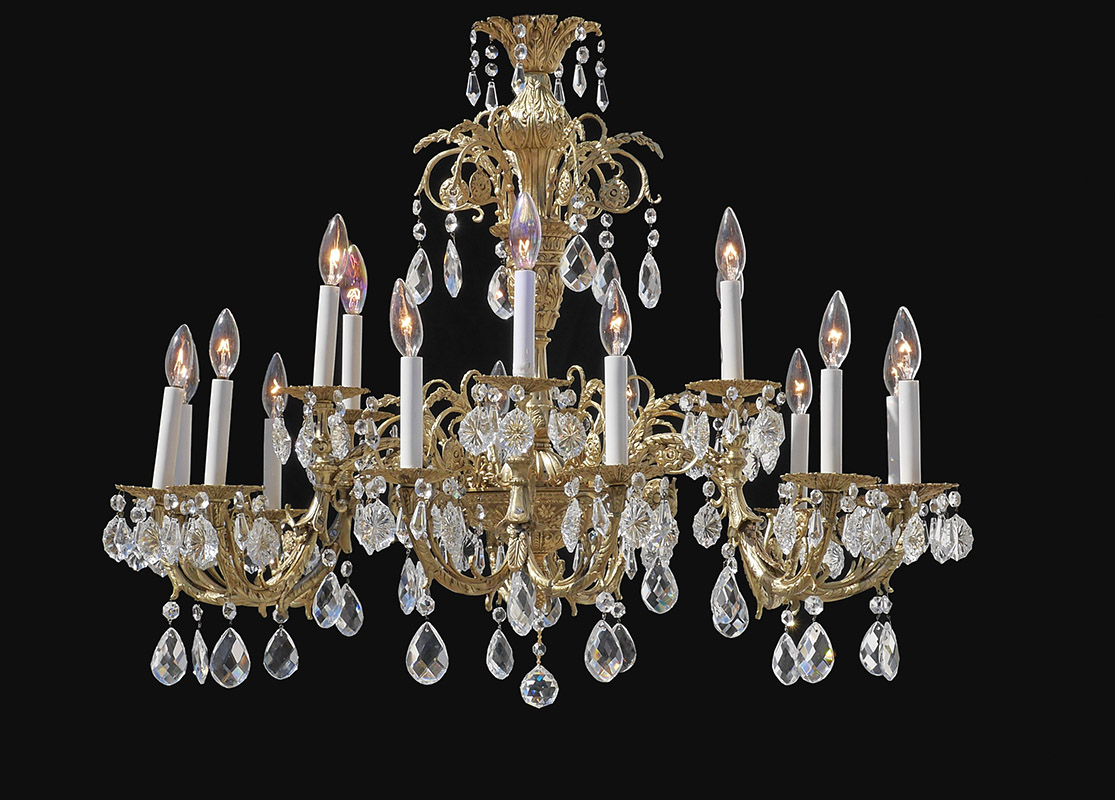 Appraisal: VINTAGE LIGHT BRASS CRYSTAL CHANDELIER Heavy embossed brass frame with