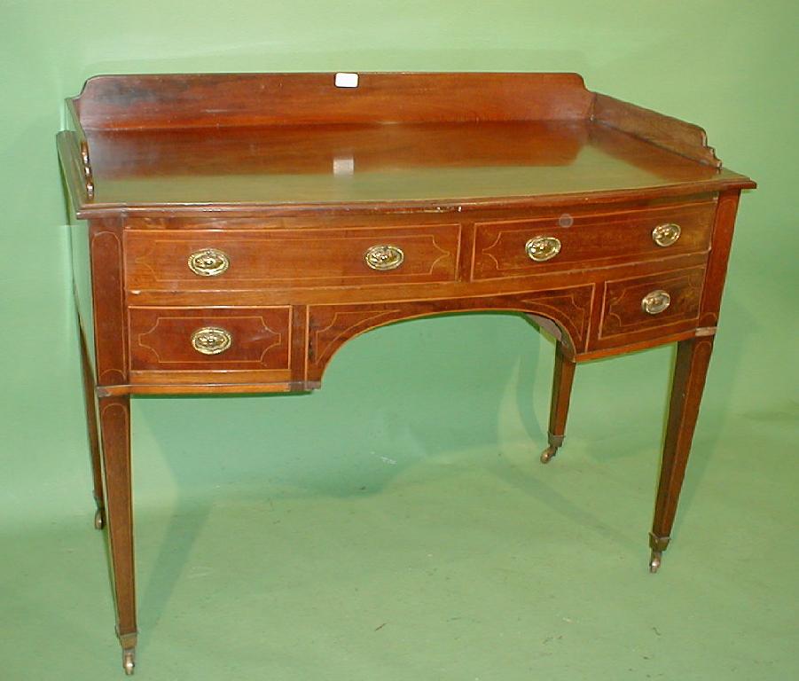 Appraisal: A George III mahogany bow front dressing table with string