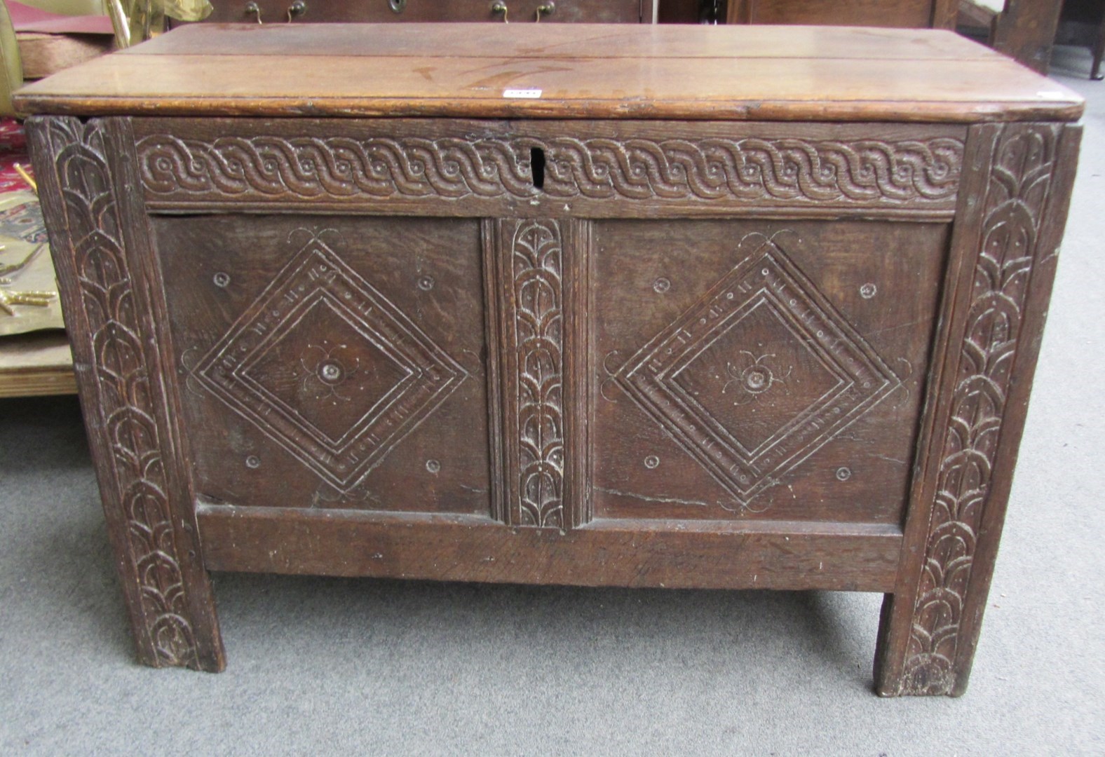 Appraisal: A th century oak coffer with carved double panel front