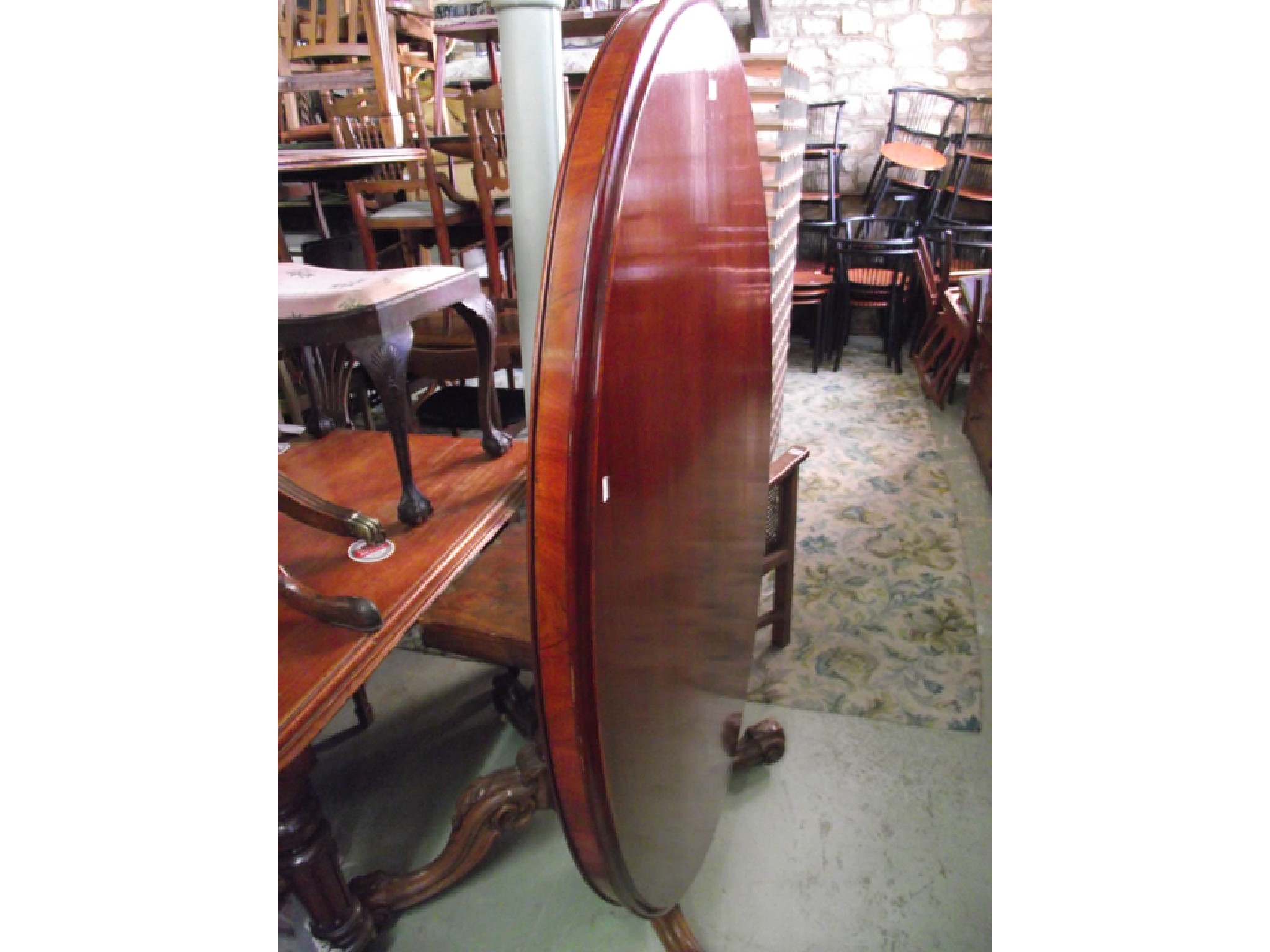 Appraisal: A Victorian mahogany loo tea table the top of oval