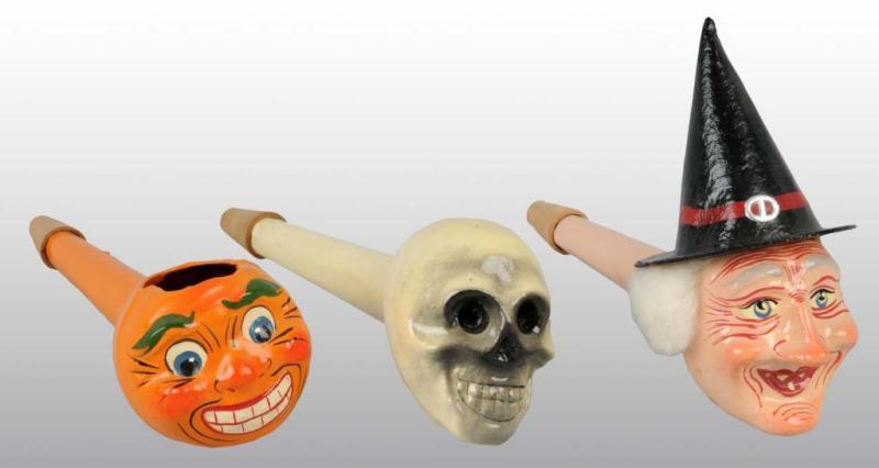 Appraisal: Lot of Paper Mache Halloween Whistles Description Includes witch skull