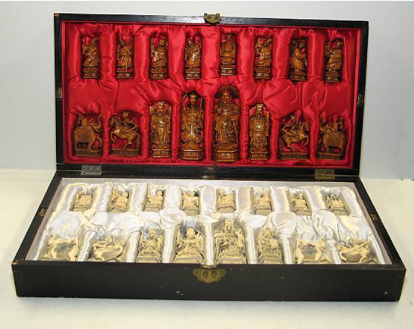 Appraisal: Two tinted ivory chess sets Each set stored in a