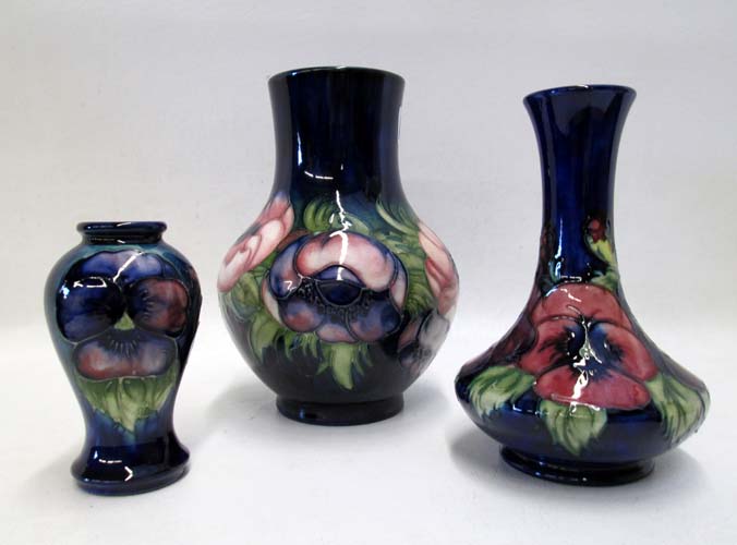 Appraisal: THREE ENGLISH MOORCROFT POTTERY VASES hand painted under glaze on