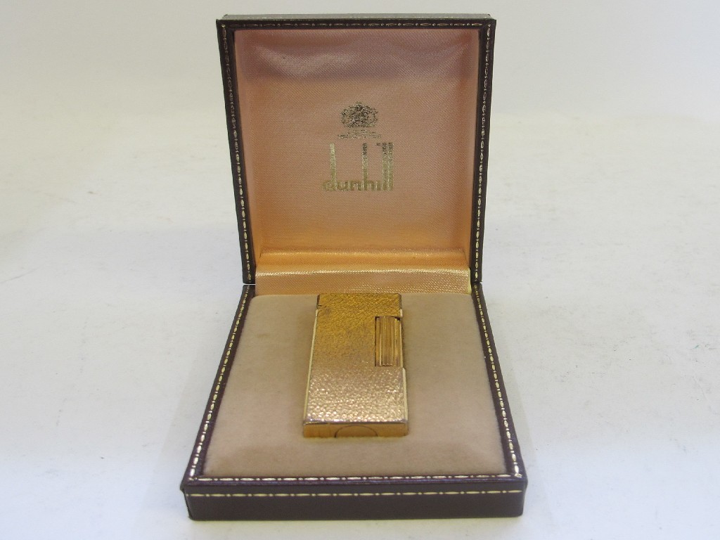 Appraisal: A Dunhill gilt metal cigarette lighter in case