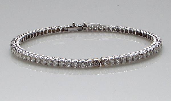 Appraisal: A diamond bangle bracelet estimated total diamond weight carats mounted