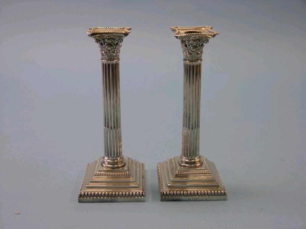 Appraisal: A pair of George III-style silver candlesticks stop-fluted Corinthian columns