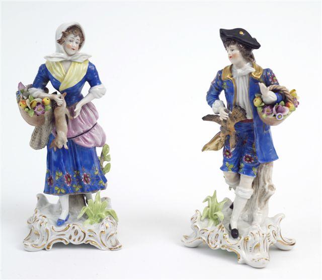 Appraisal: PAIR OF CONTINENTAL PORCELAIN FIGURES each modelled in th century