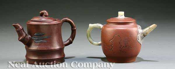 Appraisal: Two Chinese Yixing Pottery Teapots th c the first ovoid