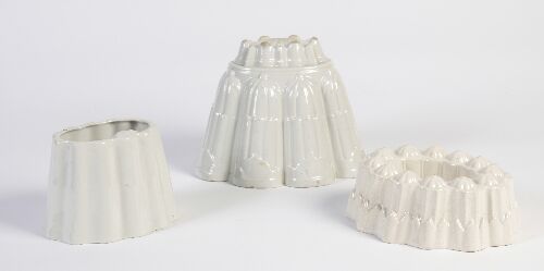 Appraisal: A collection of eighteen earthenware jelly and blancmange moulds each