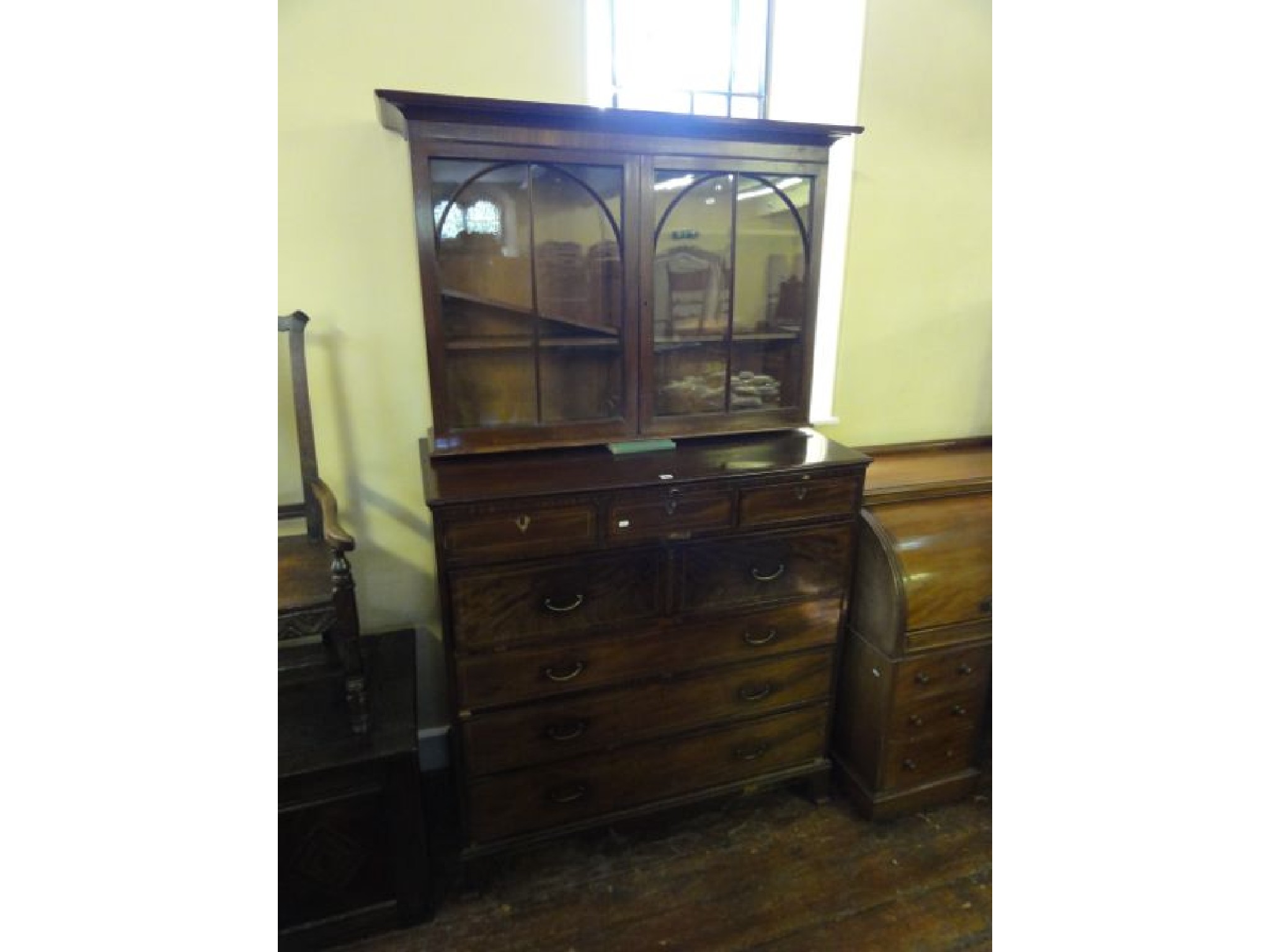 Appraisal: A substantial Georgian mahogany secretaire bookcase the secretaire drawer fitted