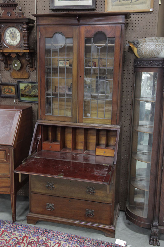 Appraisal: SECRETARY BOOKCASE Oak having leaded glass doors paneled drop lid