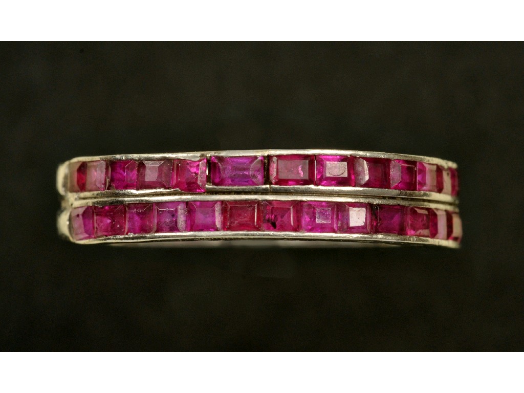 Appraisal: A Ruby half-Eternity Ring channel-set two rows calibre-cut stones in