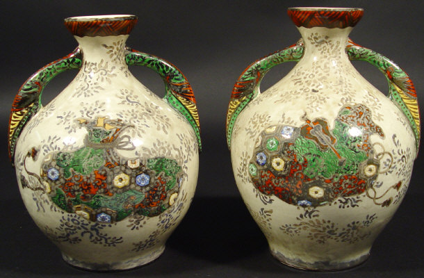 Appraisal: Pair of oriental pottery vases hand painted with objects onto