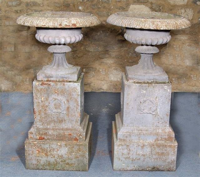 Appraisal: A PAIR OF VICTORIAN CAST IRON PAINTED GARDEN URNS of