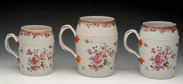 Appraisal: A SET OF THREE CHINESE FAMILLE ROSE CYLINDRICAL TANKARDS of