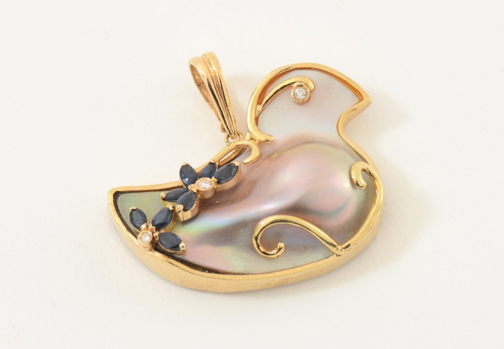 Appraisal: K PEARL SAPPHIRE DIAMOND BIRD PENDANT Bird shaped blister pearl