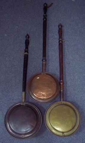 Appraisal: Three copper warming pans with turned wood handles