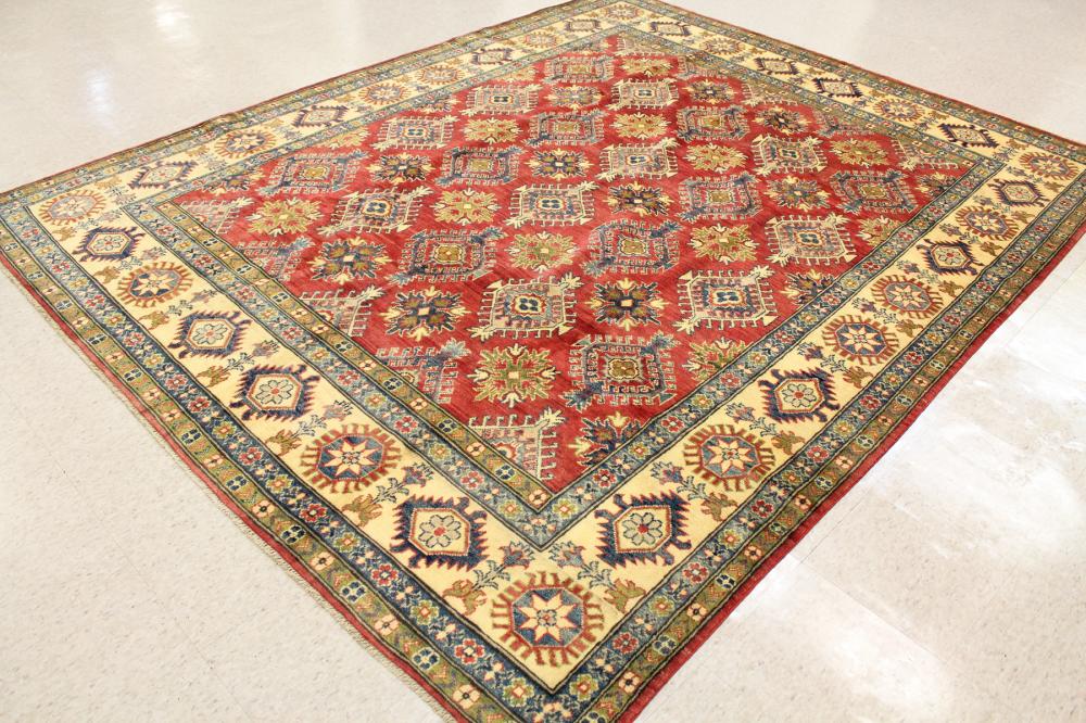 Appraisal: HAND KNOTTED ORIENTAL CARPET Pakistani Caucasian overall geometric medallion design