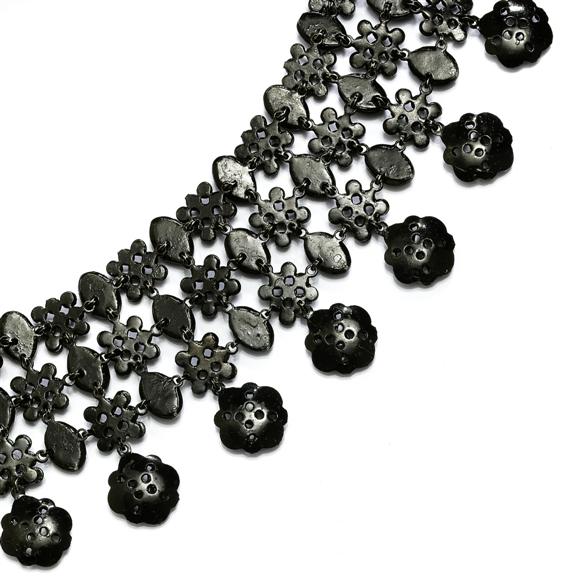 Appraisal: A BLACK GLASS STONE NECKLACE and BROOCH probably Gablonz circa