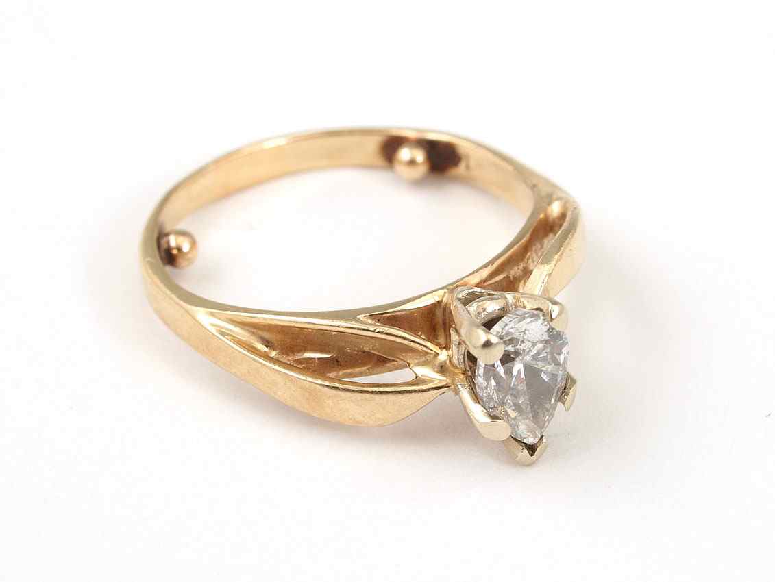 Appraisal: CT PEAR DIAMOND ENGAGEMENT RING K yellow gold ring centers