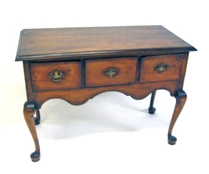 Appraisal: Queen Anne style cherry lowboy The rectangular top above three