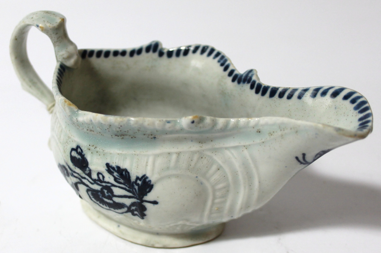 Appraisal: An thC blue and white porcelain sauceboat of cape outline