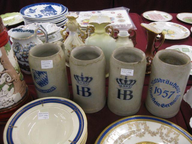 Appraisal: German Pottery Steins various advertising tall some chips