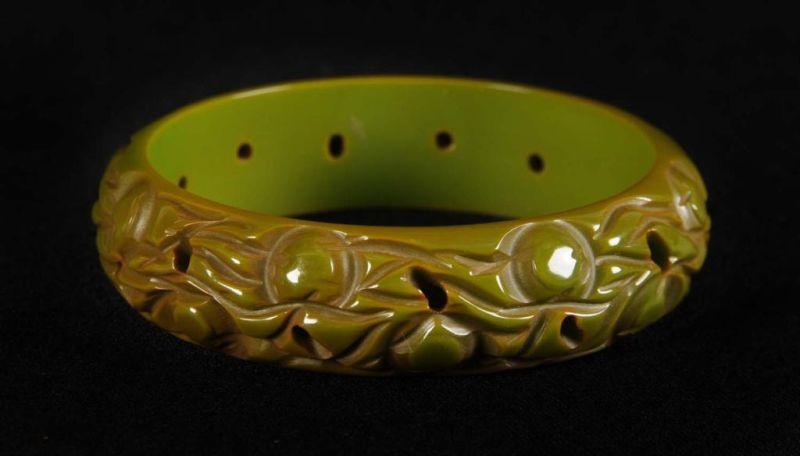 Appraisal: Bakelite Cream Green Carved Fruit Bracelet Condition Near Mint Size