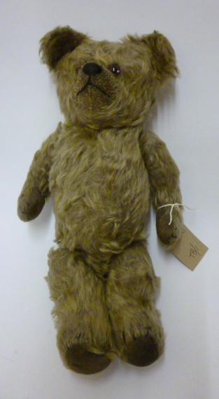 Appraisal: An early th century teddy bear straw filled covered in