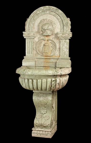 Appraisal: A Baroque style green marble wall fountain The arched crest