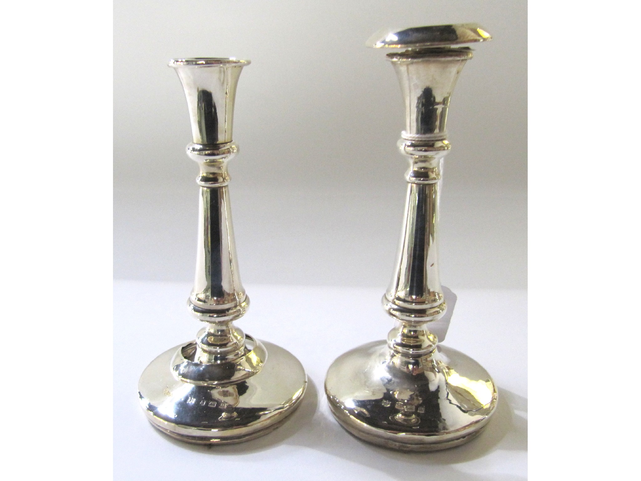 Appraisal: A pair of silver candlesticks one missing drip pan Birmingham