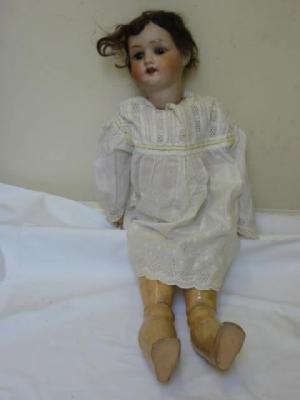 Appraisal: A Ernst Heubach bisque head girl doll with brown glass