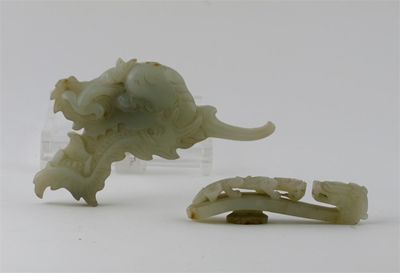 Appraisal: A Chinese jade carving of a dragon's head and another