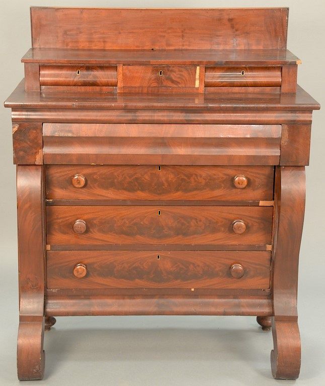 Appraisal: Three over four drawer Empire mahogany chest having gallery back