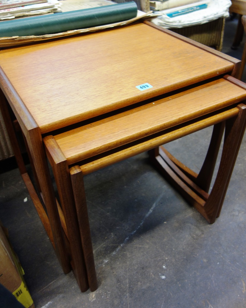 Appraisal: A nest of three retro G plan teak coffee tables