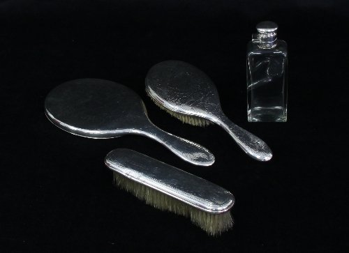 Appraisal: A silver backed dressing set London comprising hand mirror hair