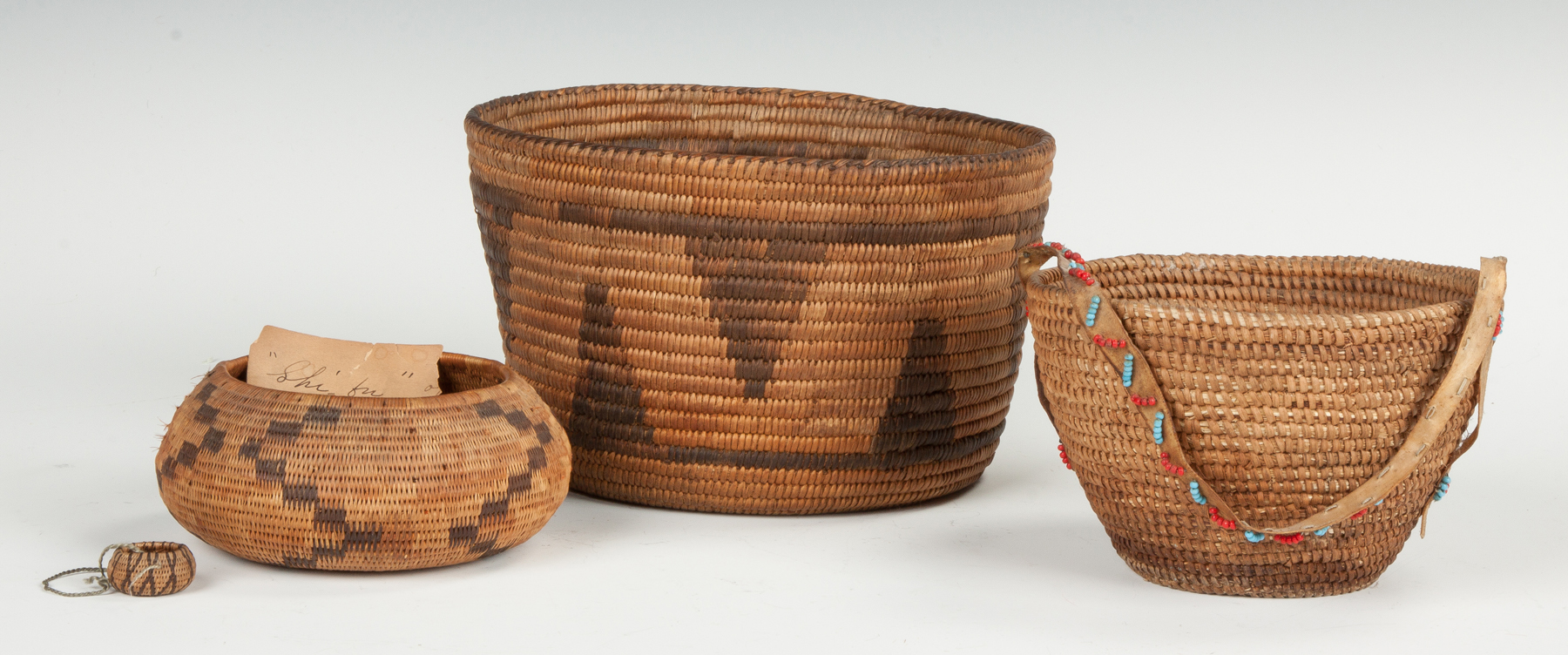 Appraisal: Group of Native American Baskets Including one miniature Left is