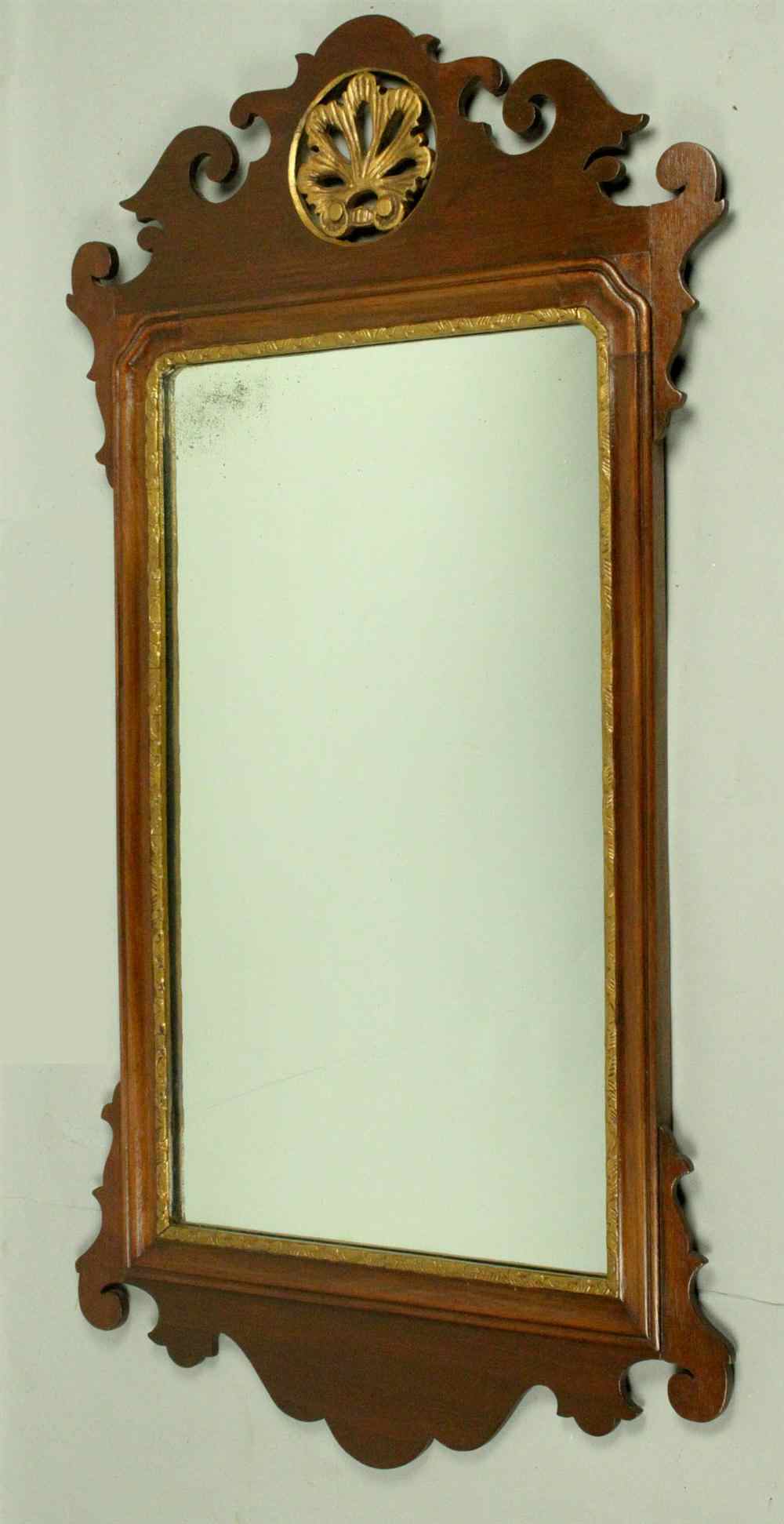 Appraisal: GEORGIAN MAHOGANY CARVED AND GILT MIRROR having a scroll worked