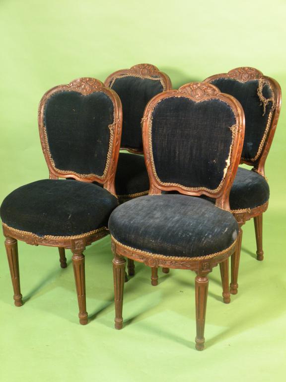 Appraisal: A set of four thC French walnut dining chairs each