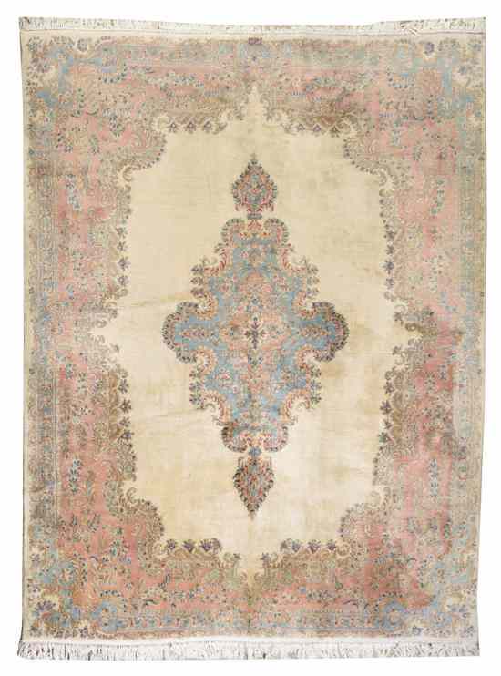 Appraisal: A Kirman Wool Rug having a diamond form center medallion