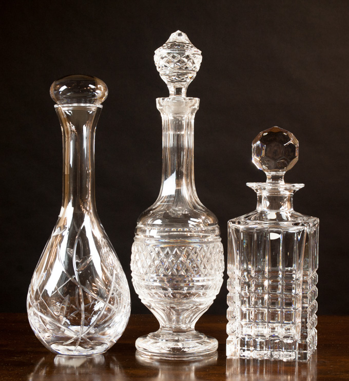 Appraisal: THREE CUT CRYSTAL DECANTERS various shapes and sizes includes by