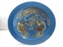 Appraisal: A large Oriental blue ceramic dish decorated with mythical beasts