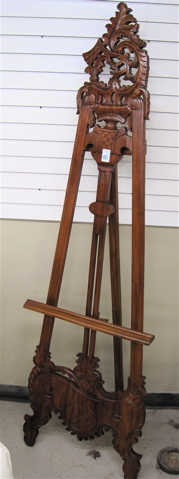 Appraisal: TALL MAHOGANY TRIPOD ART EASEL with carved crest and base