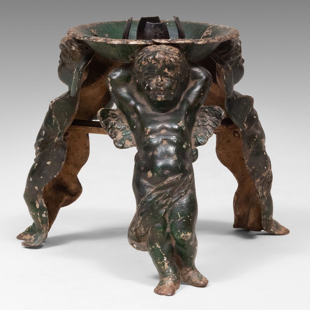 Appraisal: German Painted Iron Christmas Tree Stand with Cherub Form Supports