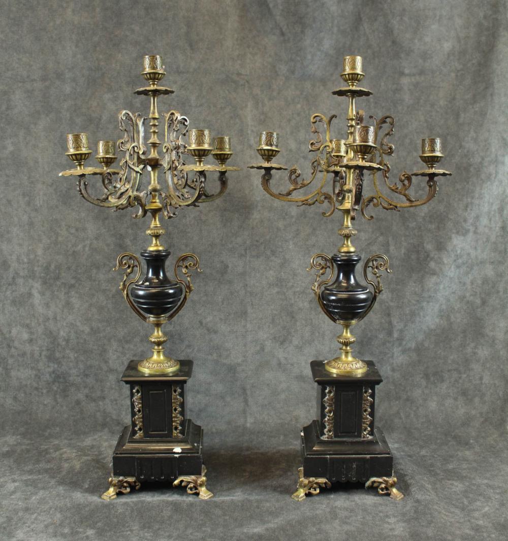 Appraisal: A PAIR OF BRASS AND BLACK MARBLE CANDELABRA Continental th