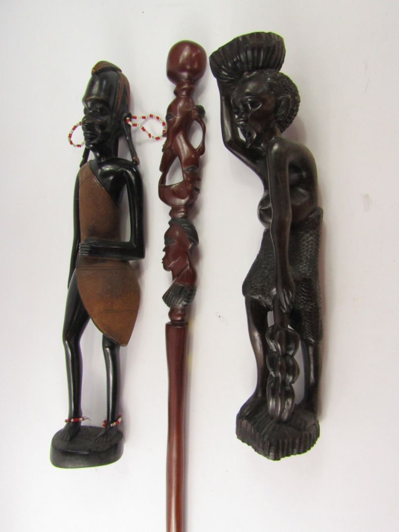 Appraisal: African carved tribal figures longboat paddles and sundries qty