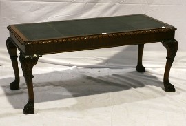 Appraisal: A George II style coffee table with leather inset top