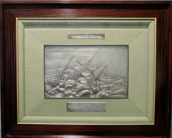 Appraisal: - Cased silver plaque depicting the ship Kamrin Maru with