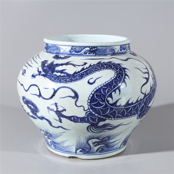 Appraisal: Chinese blue and white ceramic vessel with dragons chasing flaming