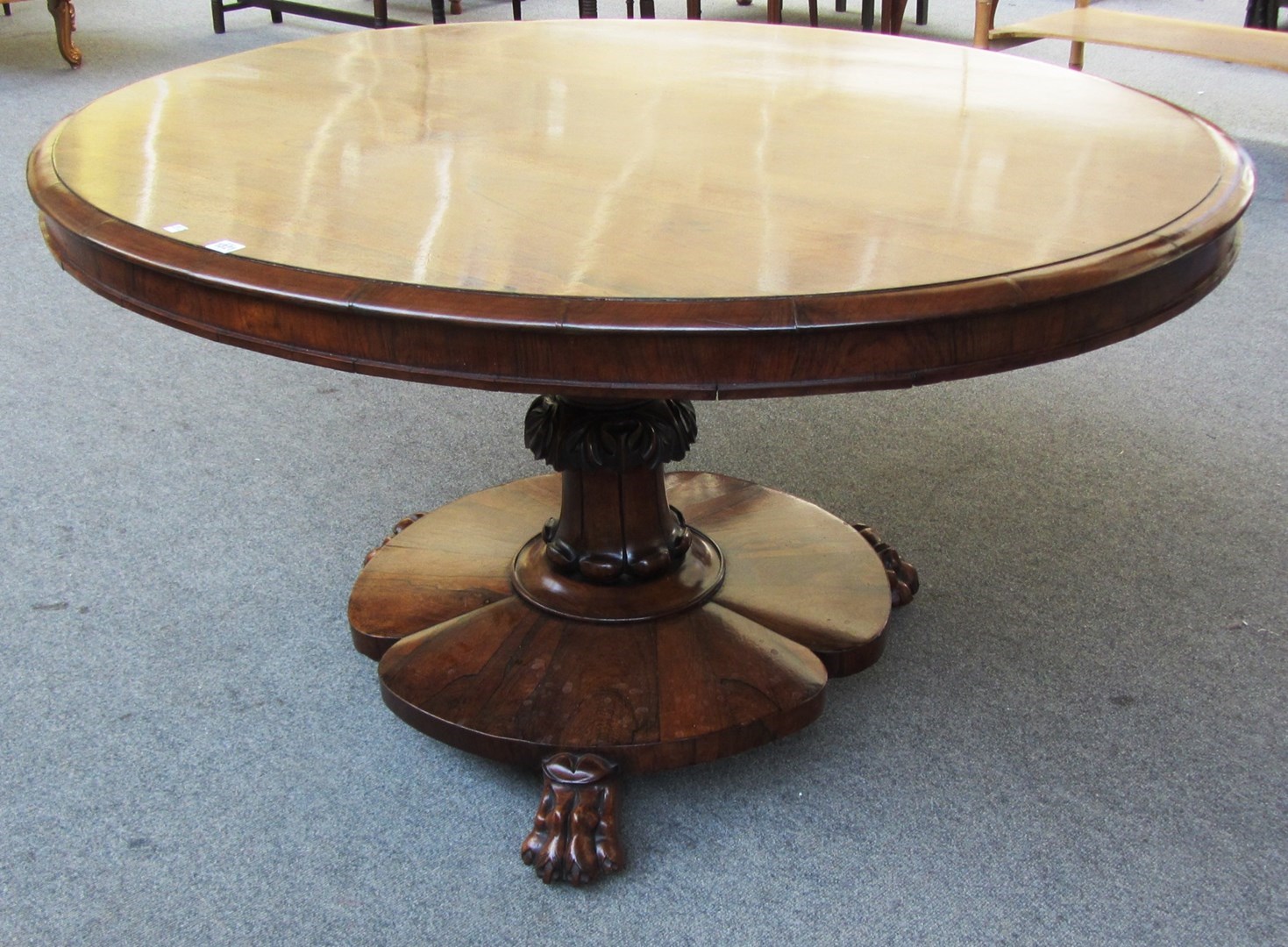 Appraisal: A William IV rosewood loo table with oval snap top